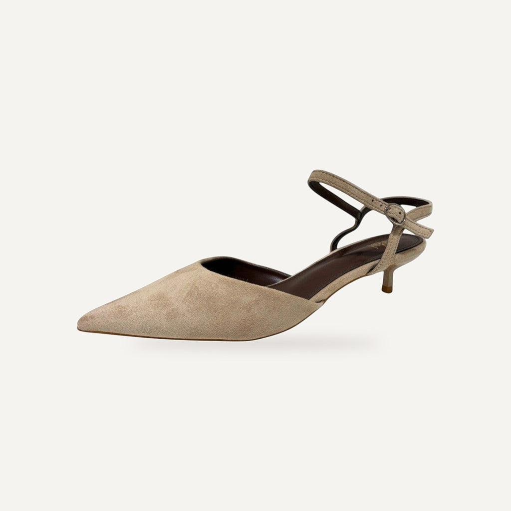 So and Ro beige suede-like pointed toe kitten heels with ankle strap and buckle closure.