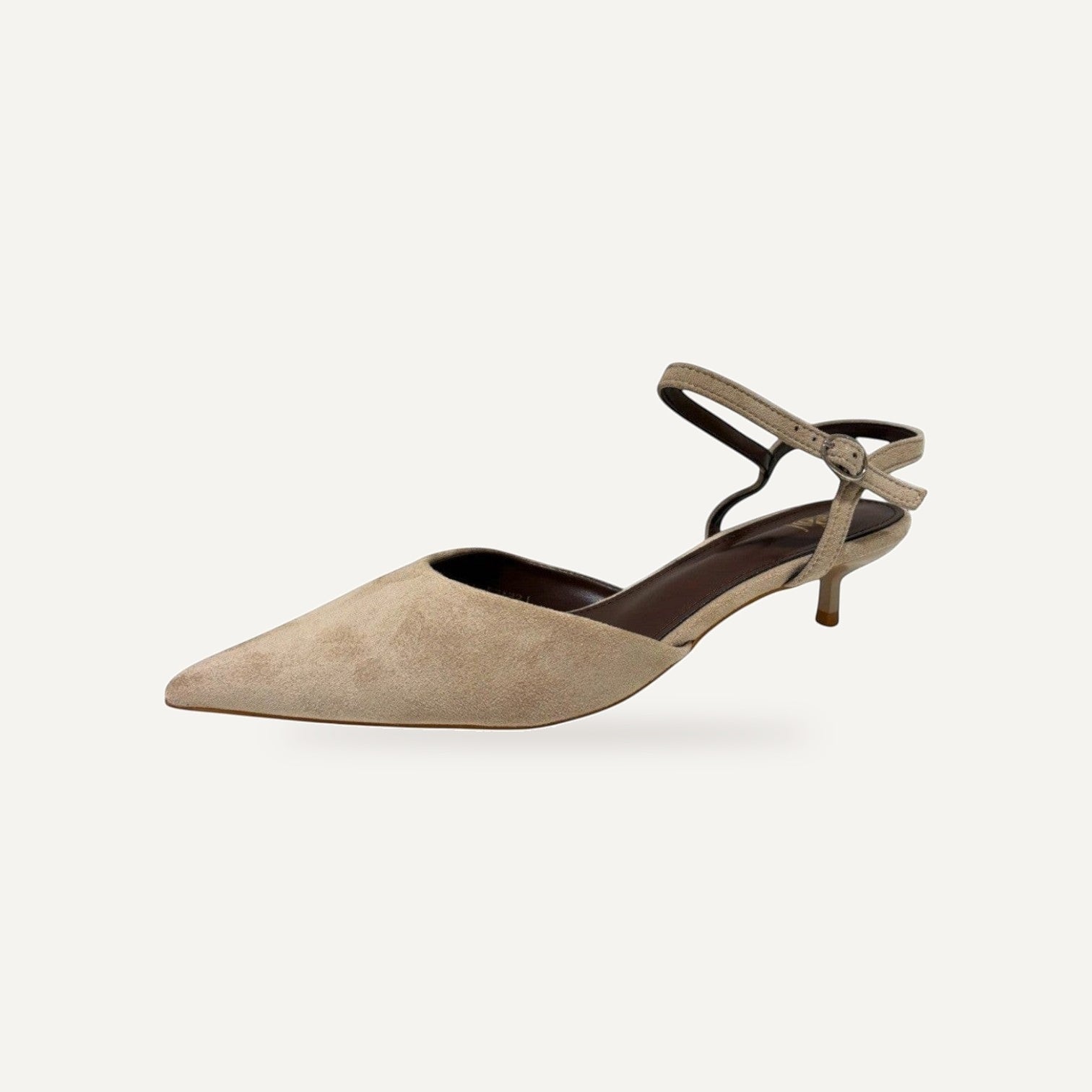 So and Ro beige suede-like pointed toe kitten heels with ankle strap and buckle closure.