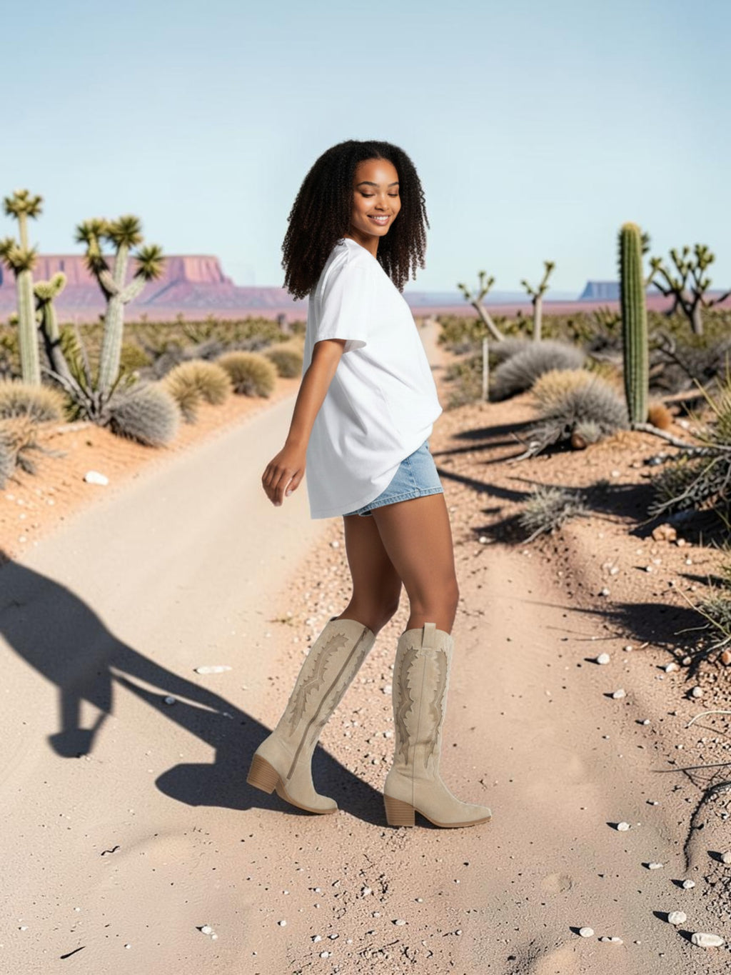 So and Ro beige micro suede Western knee-high boots with intricate embroidery and side zipper.