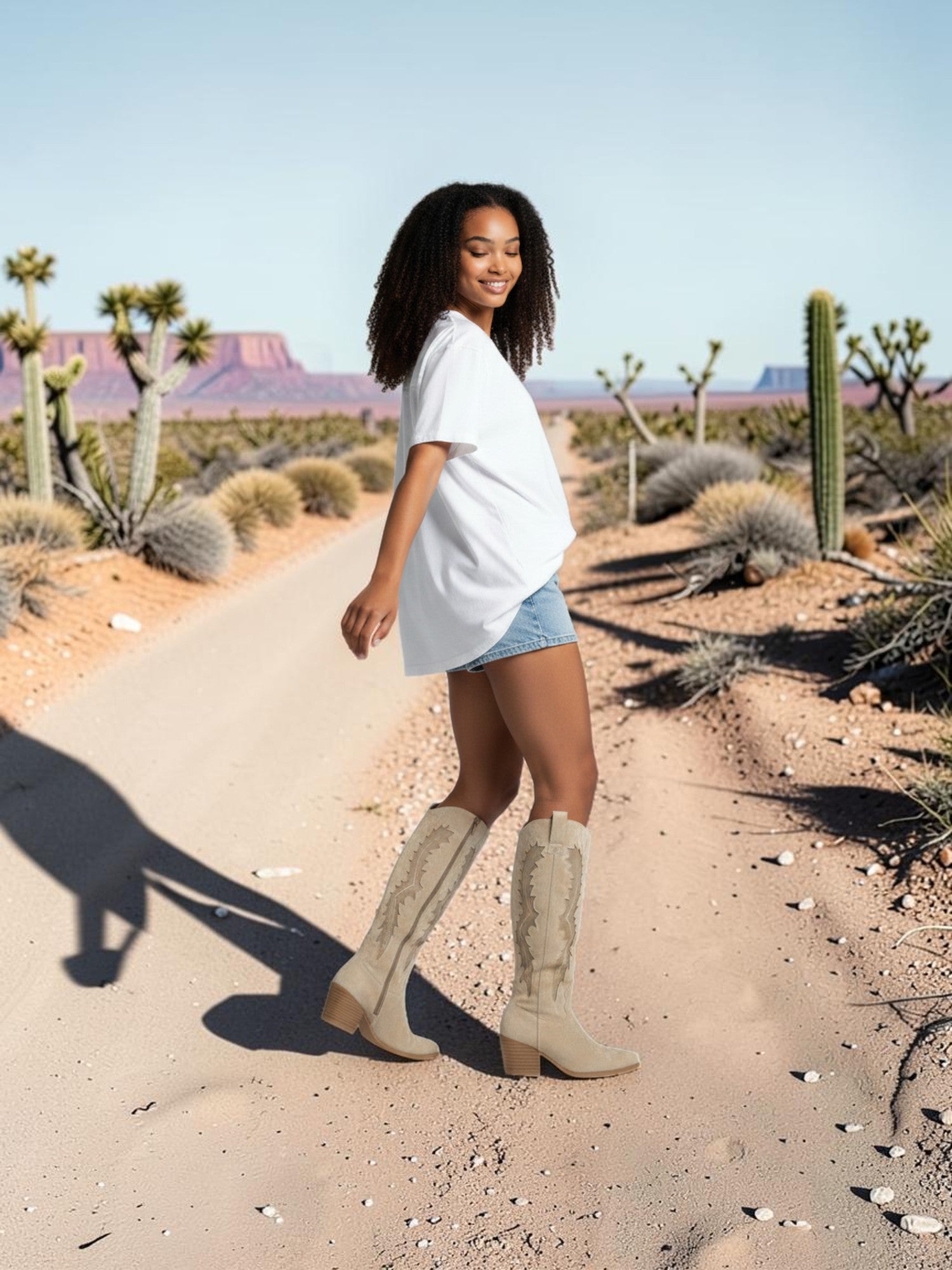 So and Ro beige micro suede Western knee-high boots with intricate embroidery and side zipper.