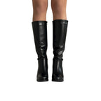 So and Ro black faux leather tall heeled riding boots with side zipper and buckle detail.