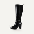 So and Ro black faux leather tall heeled riding boots with side zipper, elasticated back, and buckle detail.