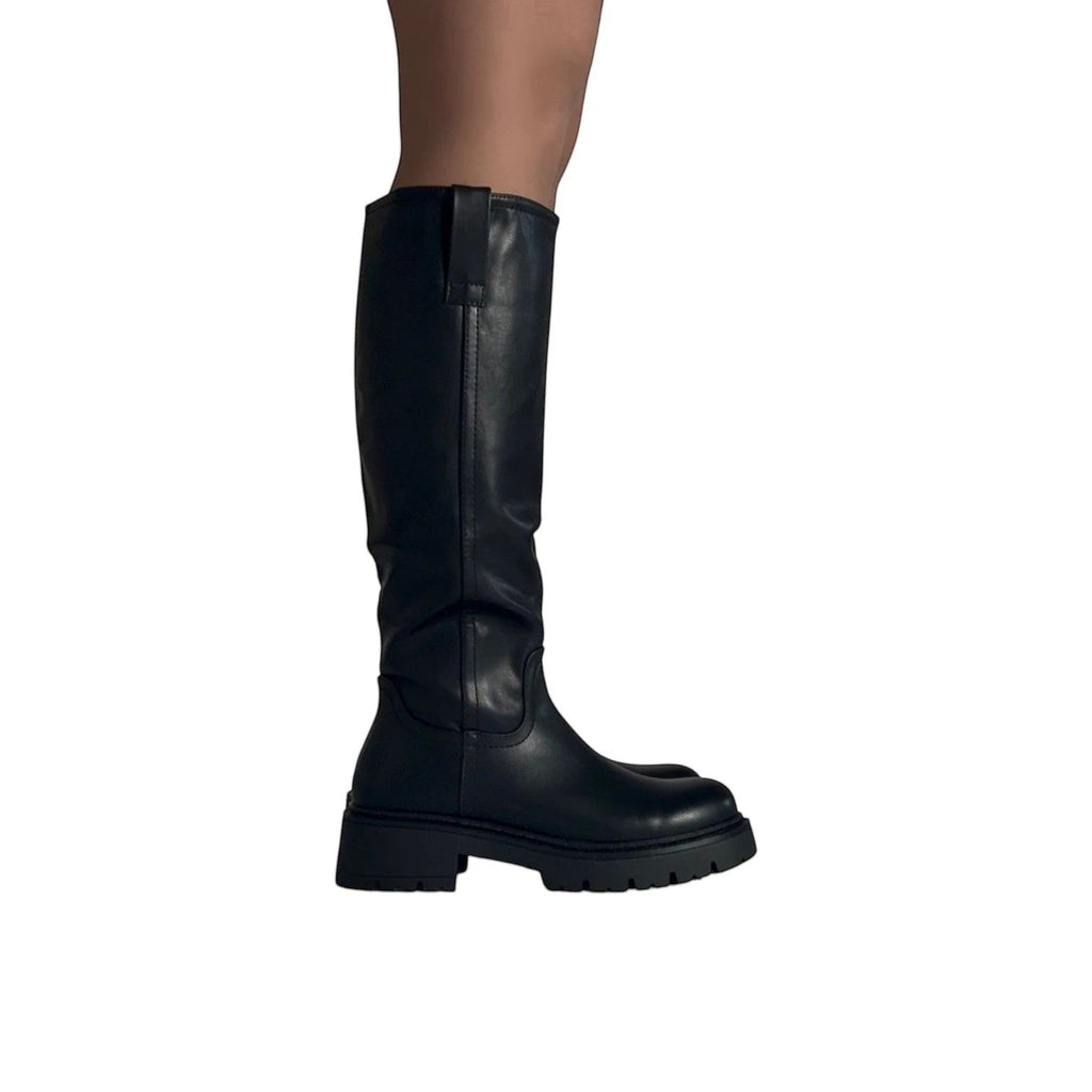 So and Ro black leather knee-high boots with a chunky sole and refined fit, perfect for festivals.