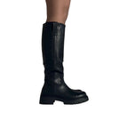 So and Ro black leather knee-high boots with a chunky sole and refined fit, perfect for festivals.