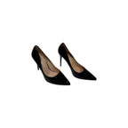 So and Ro black patent leather pointed toe stiletto heels with a sleek silhouette.