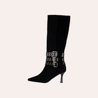 So and Ro - shoes and more - zwarte hoge XTI laarzen met spitse neus, hak en drie decoratieve zilveren gespriemen.