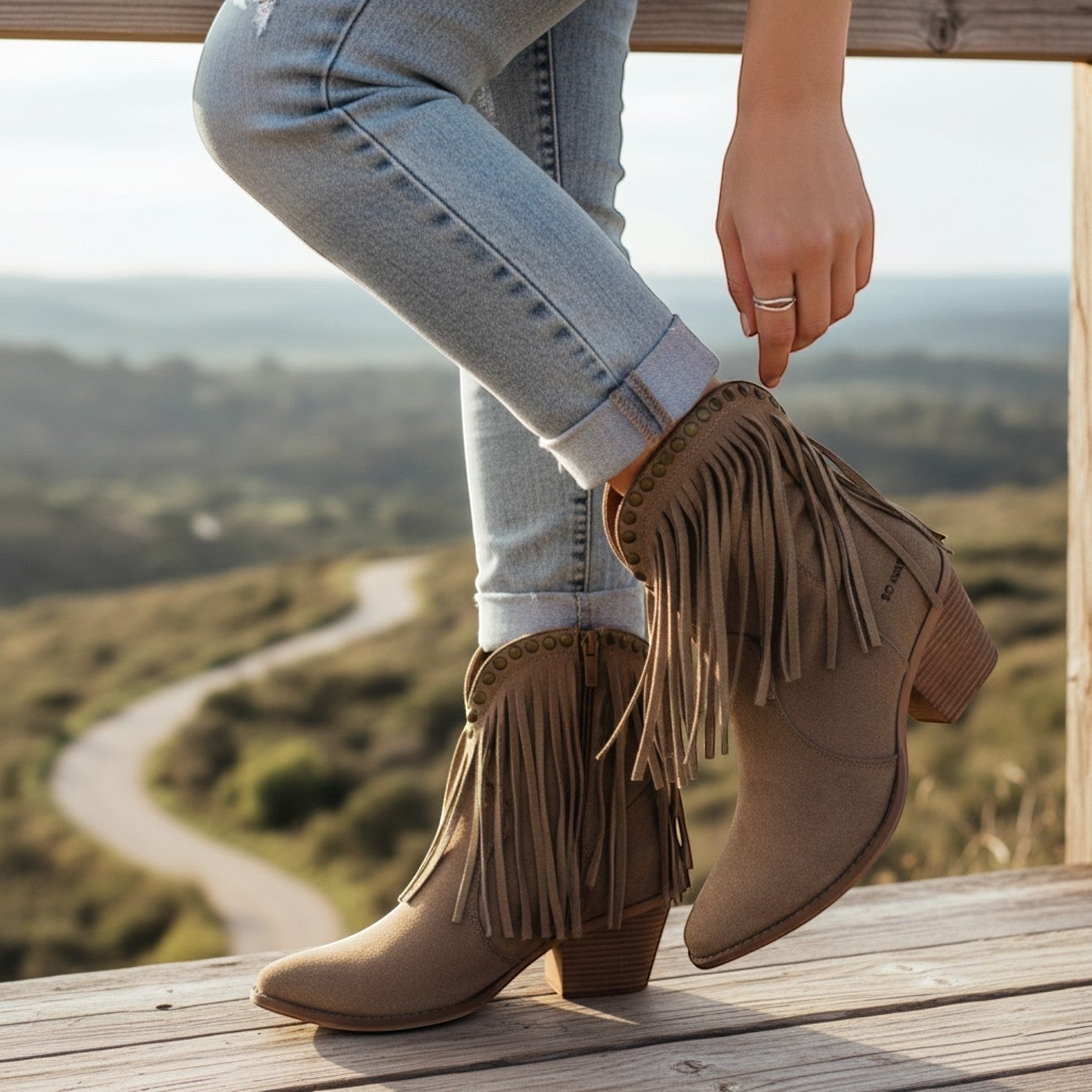 So and Ro taupe suede-look ankle boots with fringe detailing and studded trim, featuring a pointed toe and block heel.